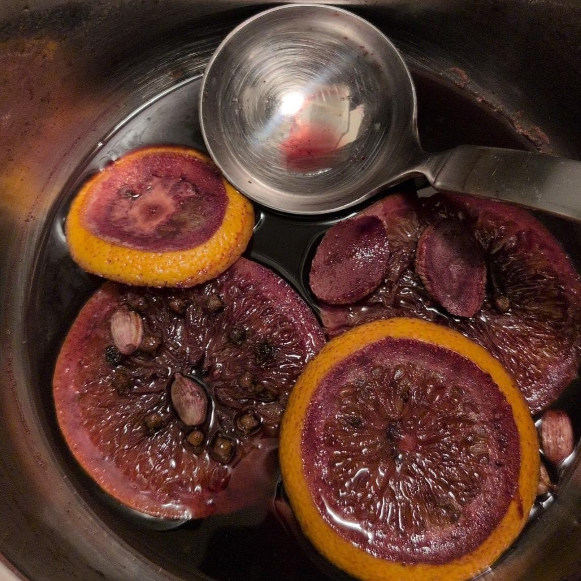 A Photo of a near empty pot of mulled wine.